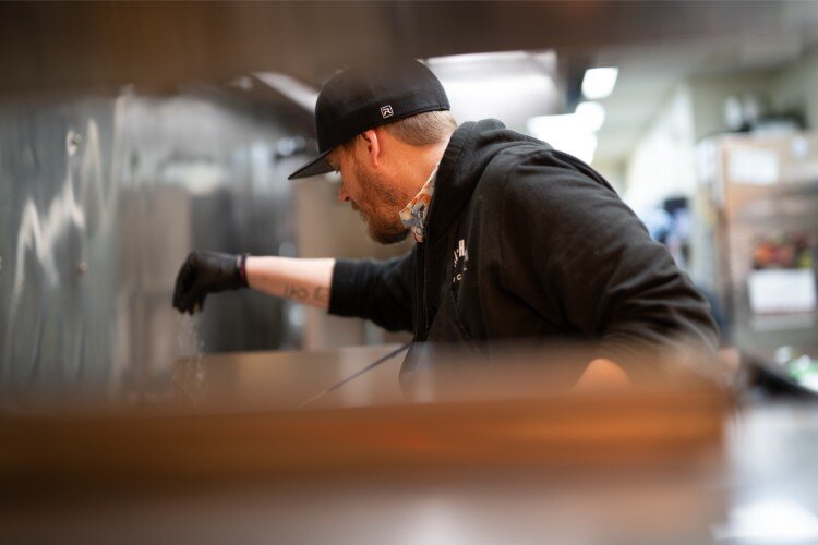 Chef Clayton James works on the lunch menu at Hi Hat.