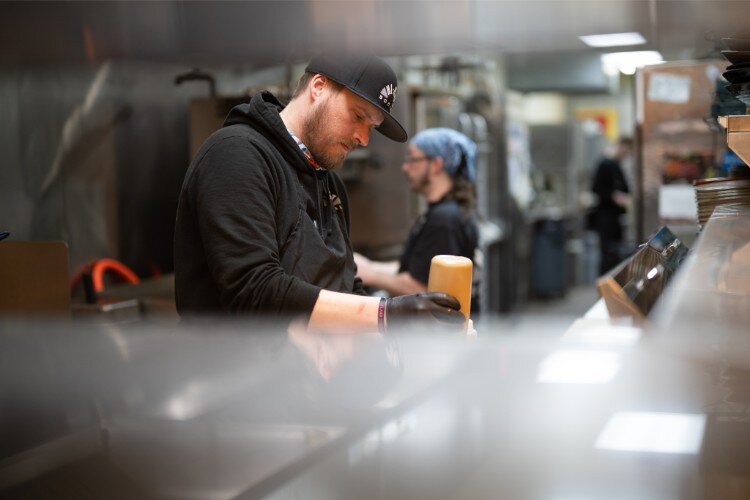 Chef Clayton James works on the lunch menu at Hi Hat.