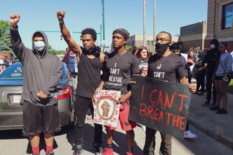 Many who gathered to peacefully protest through Springfield on Sunday brought signs to bring attention to the recent death of George Floyd in Minnesota.